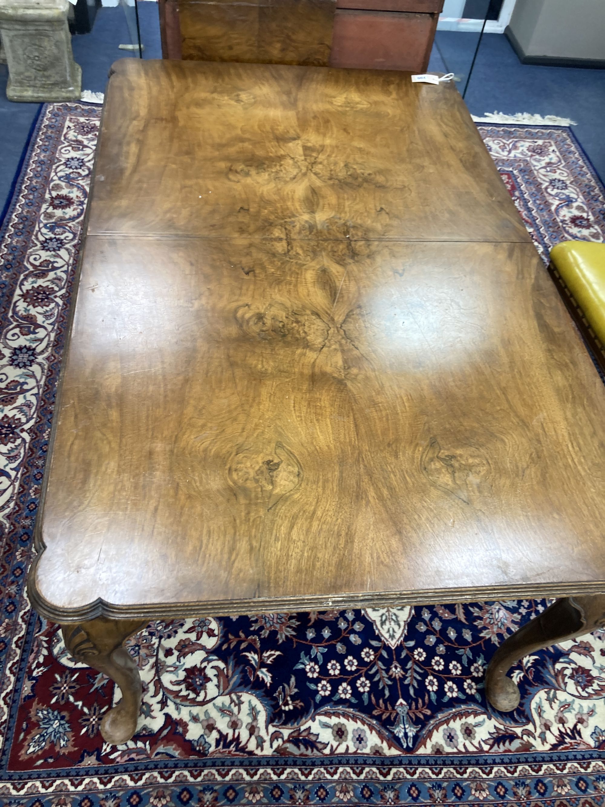 A Queen Anne revival walnut extending dining table, length 182cm extended (one spare leaf), width 90cm, height 74cm